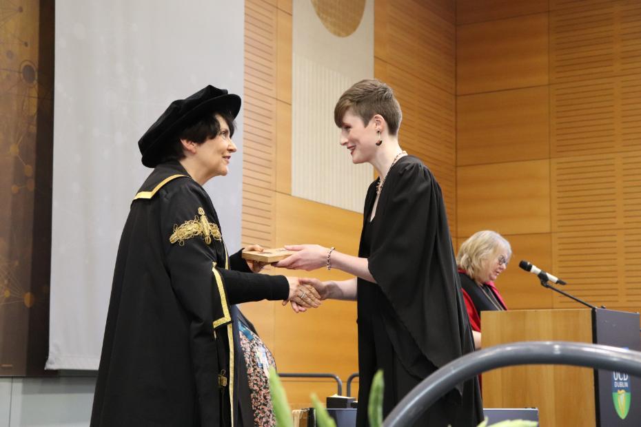 Ciara Douglas receiving her award from UCD President Professor Orla Feely